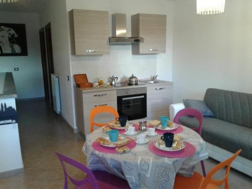 a table with plates of food on it in a living room at CASETTA RELAX A SUTRI in Sutri