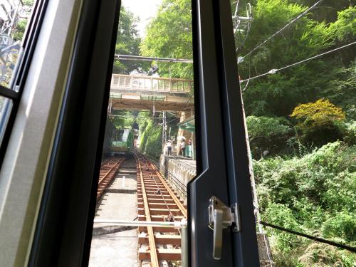 a train window with a view of a train track at Togakubo in Isehara