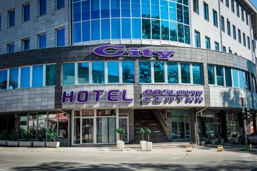 a building with a sign on the front of it at Hotel CITY in Prnjavor