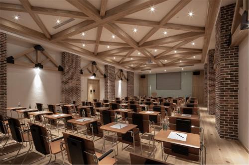 a classroom with desks and chairs in a room at Manli Hotel Shanghai Pudong Airport Branch -Provide free shuttle buses to Pudong Airport and Disneyland in Shanghai