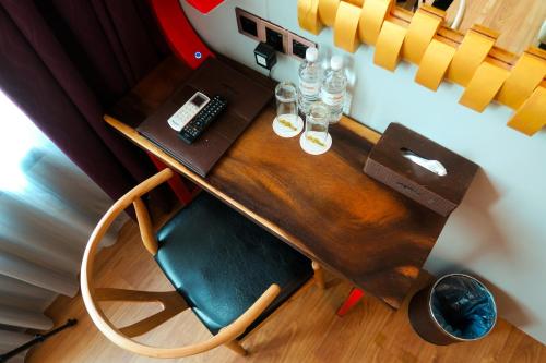 an overhead view of a desk with a keyboard and glasses at Le Dream Boutique Hotel in George Town