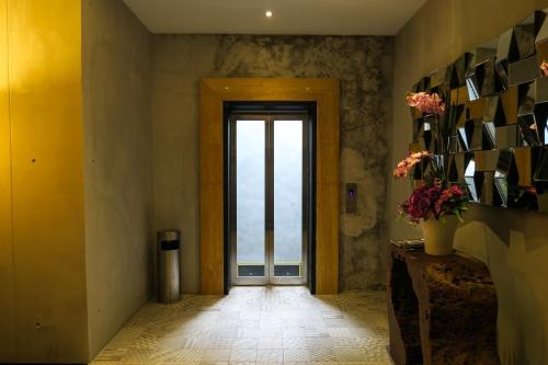 a hallway with a door with a view of the ocean at Le Dream Boutique Hotel in George Town