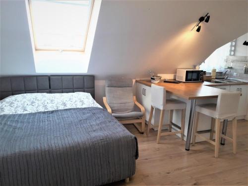 Posteľ alebo postele v izbe v ubytovaní Pietrzak Apartments