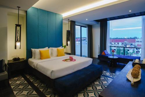 Ένα ή περισσότερα κρεβάτια σε δωμάτιο στο Monthara Angkor Residence