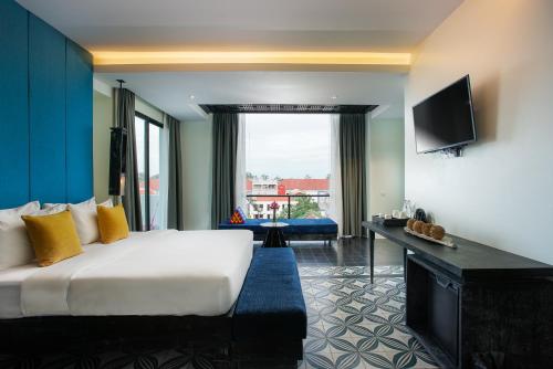 Ένα ή περισσότερα κρεβάτια σε δωμάτιο στο Monthara Angkor Residence