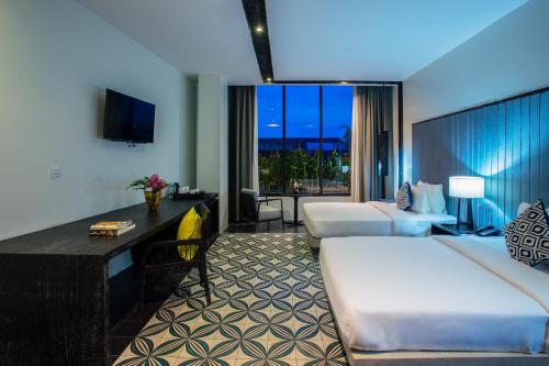 Ένα ή περισσότερα κρεβάτια σε δωμάτιο στο Monthara Angkor Residence