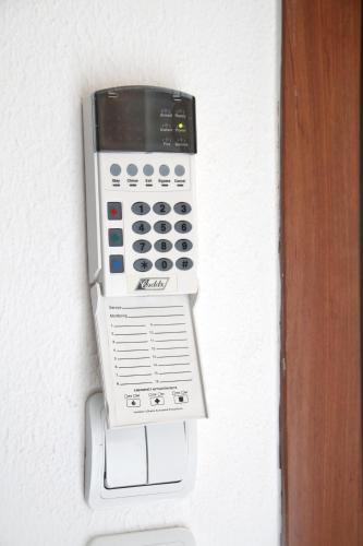 a soap dispenser is attached to a wall at Apartment for Family in Kriopigi