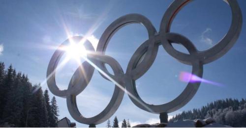 a statue of the olympic rings in front of the sun at Planinska idila - uz stazu in Jahorina
