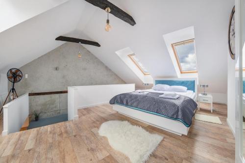 Säng eller sängar i ett rum på Apartamenty Sun & Snow Jantar Park