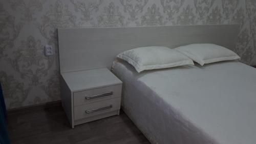 Ένα ή περισσότερα κρεβάτια σε δωμάτιο στο Apartment on Metallurgov 32