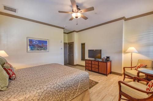 a bedroom with a bed and a flat screen tv at St George Inn - Saint Augustine in Saint Augustine