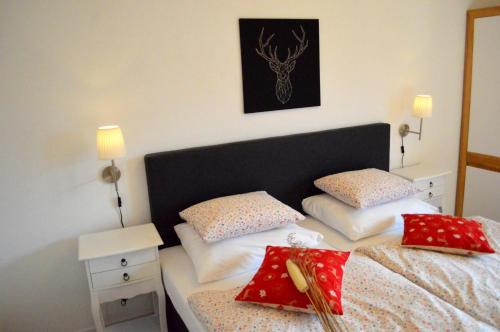 a bedroom with a bed with two pillows on it at Haus Susanne in Radstadt