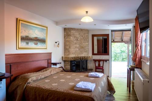 Кровать или кровати в номере Tasia Mountain Hotel