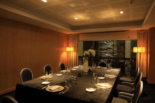 a conference room with a long table and chairs at Sofitel Casablanca Tour Blanche in Casablanca