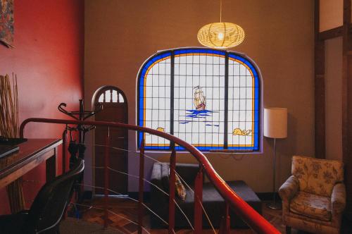 a room with a staircase and a stained glass window at Bella 269 Guest house in Santiago