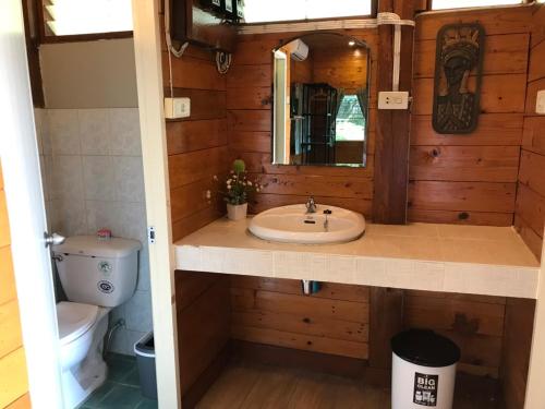 a bathroom with a sink and a toilet at Dreamhome Chiangdao in Chiang Dao