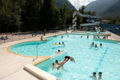 a group of people in a swimming pool at Le Pas de L'Ours in Aston