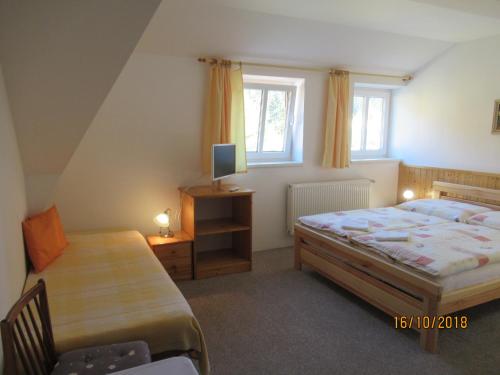 Postel nebo postele na pokoji v ubytování Guest House U Marie