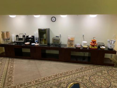 a counter in a hotel room with food on it at Bedford Plaza Hotel - Boston in Bedford