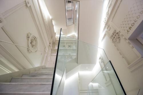 a staircase in a building with a glass case at Sant Jordi Hostels Rock Palace in Barcelona