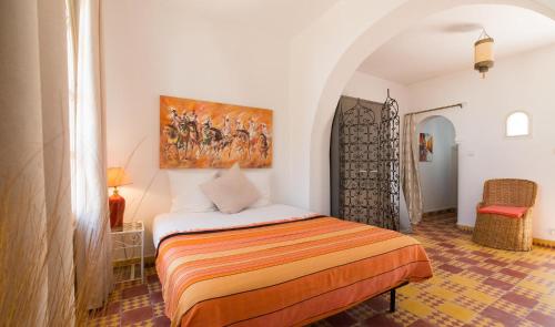 Villa Amaryllis tesisinde bir odada yatak veya yataklar