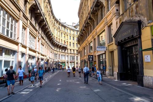 a group of people walking down a street at Luxury & Panorama Apartments in Budapest