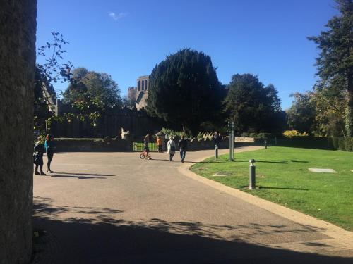 a group of people walking down a road in a park at The Lodge at Bodenlodge in Malahide