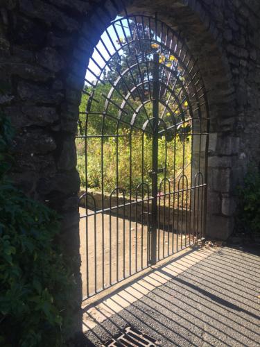 an entrance to a gate in a stone archway at The Lodge at Bodenlodge in Malahide