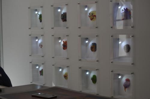 a wall of glass with different types of objects on it at Hotel Gran Mariscal Quito in Quito