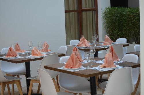 a group of tables with napkins on top of them at Hotel Gran Mariscal Quito in Quito