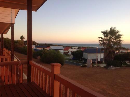 a porch of a house with a view of the ocean at Seaspray Beach Holiday Park in Dongara
