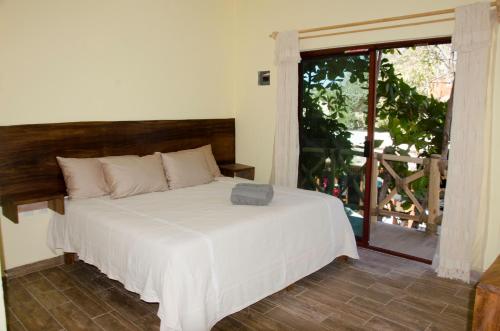 a bedroom with a bed and a large window at Verde Luna in San Francisco