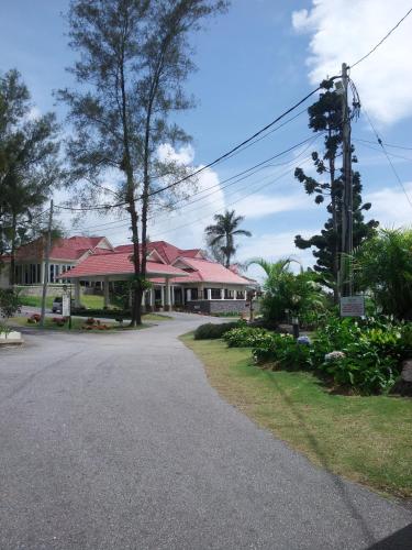 an empty road in front of a house at The Jerai Hill Resort in Yan