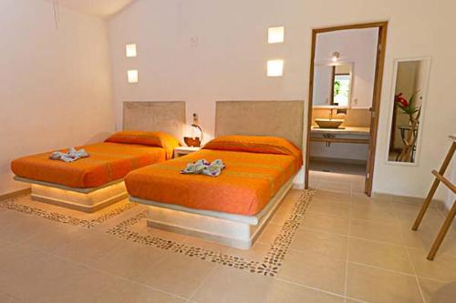 Ένα ή περισσότερα κρεβάτια σε δωμάτιο στο Villas Naomi