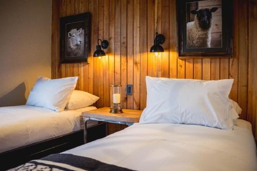 Postel nebo postele na pokoji v ubytování Hostal Boutique Factoria Patagonia
