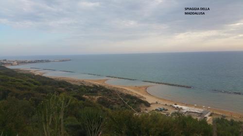 a view of a beach and the ocean at Casa Villaggio Pirandello in Agrigento