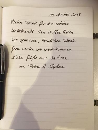 a piece of white paper with writing on it at Gästehaus Ehringhausen 63 (Anno 1719) in Remscheid
