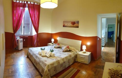 En eller flere senge i et værelse på Casa Tua a Porta Maggiore