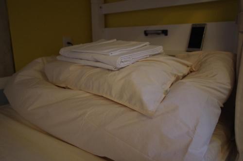 Ein Bett oder Betten in einem Zimmer der Unterkunft Cinnamon Guesthouse Dogo