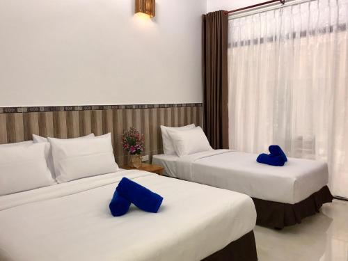 Кровать или кровати в номере Canary Bungalow