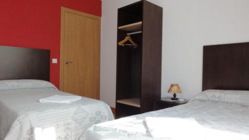 Ένα ή περισσότερα κρεβάτια σε δωμάτιο στο Aparthotel Can Gallart