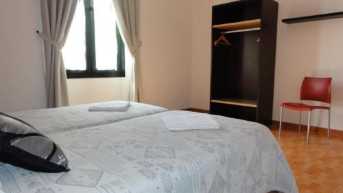 Ένα ή περισσότερα κρεβάτια σε δωμάτιο στο Aparthotel Can Gallart