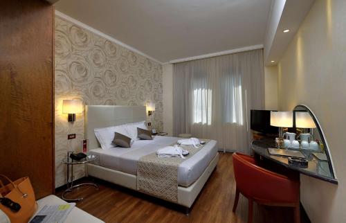 Best Western Hotel City tesisinde bir odada yatak veya yataklar