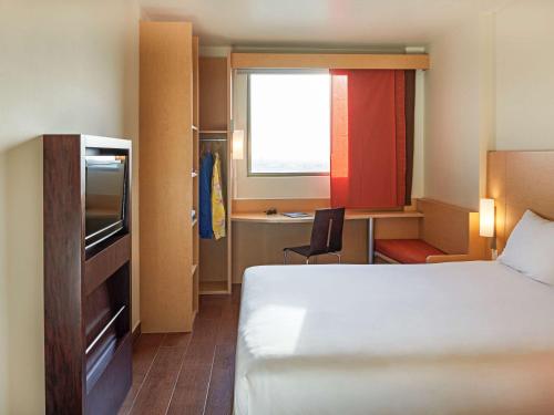 Cama ou camas em um quarto em Ibis Cancun Centro