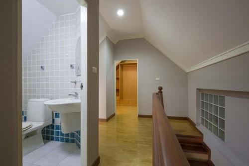 a bathroom with a sink and a toilet in it at Young Place in Bangkok