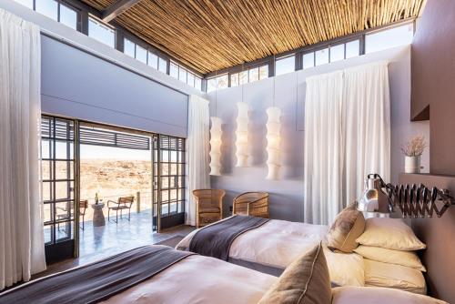 Ένα ή περισσότερα κρεβάτια σε δωμάτιο στο Fish River Lodge
