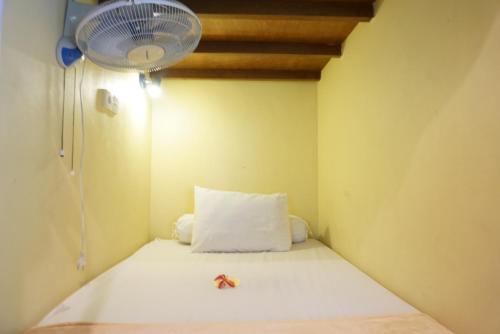Postel nebo postele na pokoji v ubytování Sila Urip Guest House