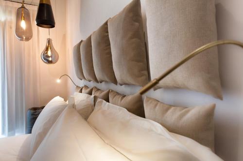 a bedroom with a bed with pillows on it at Terra di Gradara in Gradara
