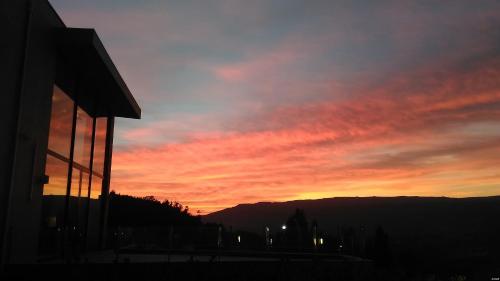 a sunset is seen from a building at Tempus Hotel & Spa in Ponte da Barca