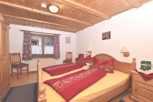 a bedroom with two beds and a window at Haus Meinecke in Bad Hindelang